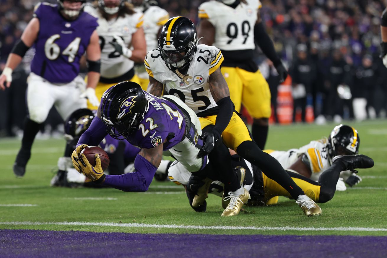 Derrick Henry #22 of the Baltimore Ravens dives for a touchdown against DeShon Elliott #25 of the Pittsburgh Steelers during the second quarter during the AFC Wild Card Playoff at M&T Bank Stadium on January 11, 2025 in Baltimore, Maryland.