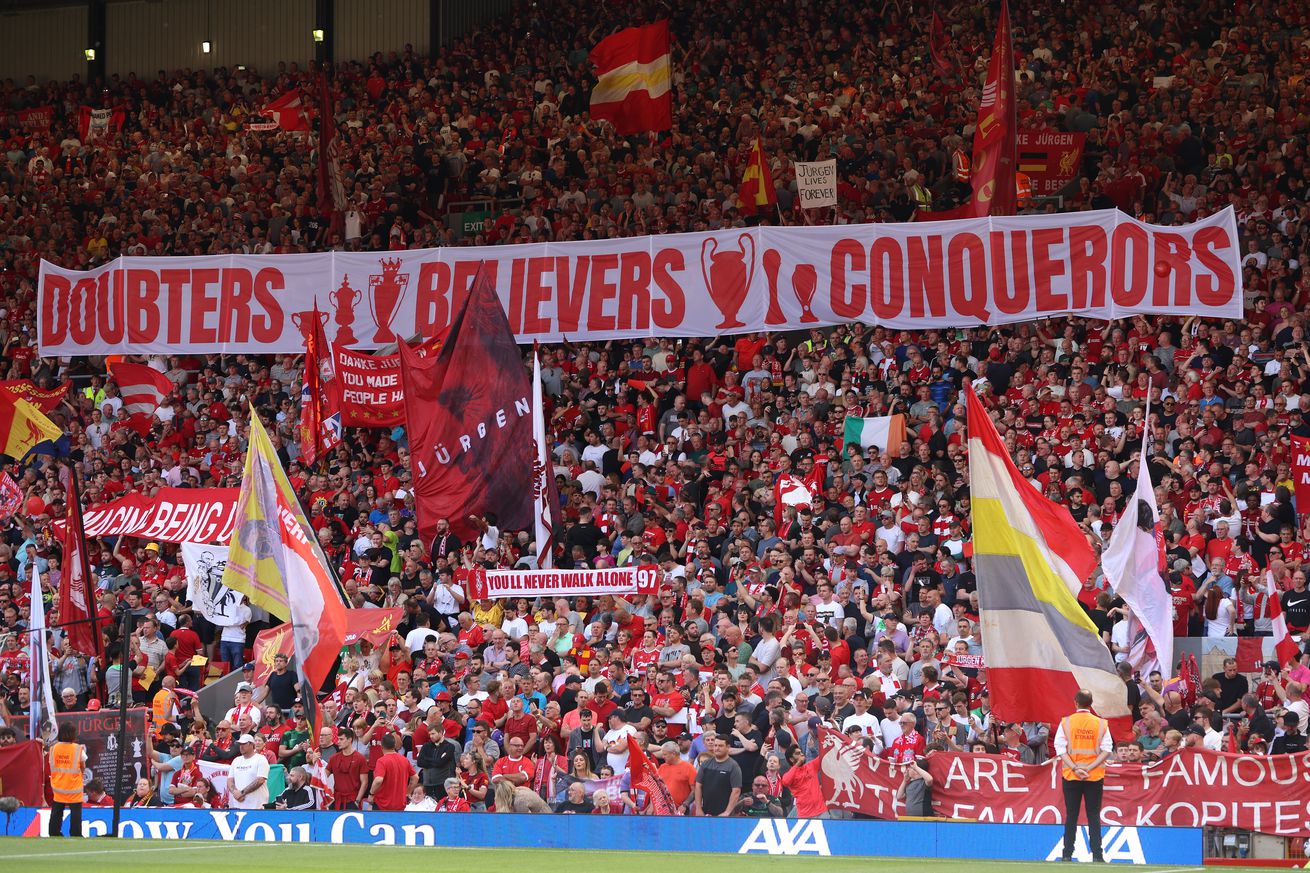 Fans of Liverpool display a banner reading “Doubters, Believers, Conquerors” prior to the Premier League match between Liverpool FC and Wolverhampton Wanderers at Anfield on May 19, 2024 in Liverpool, England.