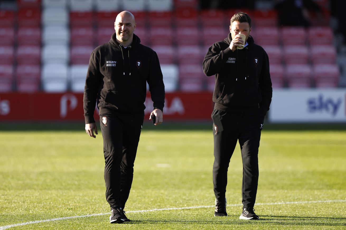 Salford City manager Neil Wood (left) and assistant manager Simon Wiles before the Sky Bet League Two play-off semi-final first leg match at the Peninsula Stadium, Salford. Picture date: Saturday May 13, 2023.